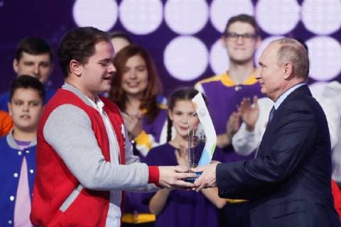 MOSCOW, RUSSIA - DECEMBER 5, 2018: Anton Korotchenko from Smolensk Region, author of the Zdorovoye Selo project (L), receives a Dobrovolets Rossii prize in the Volunteer of the Year category from the President of Russia Vladimir Putin at the 2018 Dobrovolets Rossii (Volunteer of Russia) award ceremony at CSKA Arena on International Volunteer Day; the event is part of the 2018 International Volunteer Forum. Mikhail Metzel TASS  TS099E3B