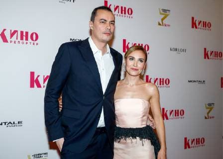 MOSCOW, RUSSIA - DECEMBER 5, 2018: Film director Zhora Kryzhovnikov (L) and his wife, actress Yulia Aleksandrovna ahead of a ceremony to present the Event of the Year 2018 prize held by the Cinema Reporter magazine at Illusion Cinema. Cinema Reporter is a new magazine that was established by the editorial staff of the Russian version of The Hollywood Reporter magazine. Artyom Geodakyan TASS  TS099F23