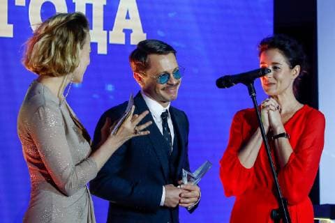 MOSCOW, RUSSIA - DECEMBER 5, 2018: Actor Pavel Derevyanko (C), winner of the Actor of the Year award, during a ceremony to present the Event of the Year 2018 prize held by the Cinema Reporter magazine at Illusion Cinema. Cinema Reporter is a new magazine that was established by the editorial staff of the Russian version of The Hollywood Reporter magazine. Artyom Geodakyan TASS  TS099F64