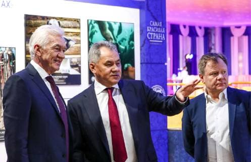 MOSCOW, RUSSIA - DECEMBER 7, 2018: Volga Group owner, businessman Gennady Timchenko (L), Russian Geographical Society President, Russia s Minister of Defence Sergei Shoigu (C), and musician Igor Butman at an exhibition of the winning entries of the Russian Geographical Society s The Most Beautiful Country photography competition at the State Kremlin Palace, the venue of the 2018 Russian Geographical Society Prize award ceremony. Anton Novoderezhkin TASS  TS09A49B