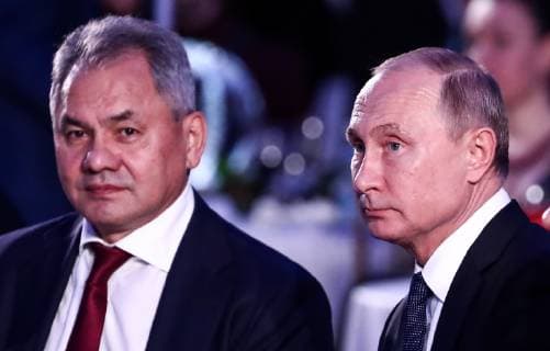 MOSCOW, RUSSIA - DECEMBER 7, 2018: Russian Geographical Society President Russia s Minister of Defence Sergei Shoigu (L) and Russia s President Vladimir Putin before the 2018 Russian Geographical Society Prize award ceremony at the State Kremlin Palace. Anton Novoderezhkin TASS  TS09A4EB