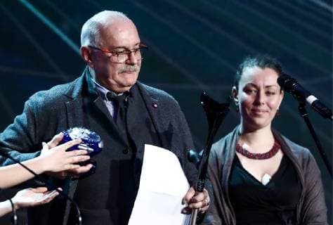 MOSCOW, RUSSIA - DECEMBER 7, 2018: Anor Tukayeva, director of the charity foundation Krokhino Centre for the Restoration of Cultural Heritage (R), receives the Special Jury Award of the 2018 Russian Geographical Society Prize from film director Nikita Mikhalkov at the award ceremony at the State Kremlin Palace. Anton Novoderezhkin TASS  TS09A54B