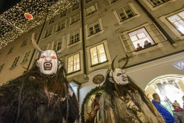 Krampuslauf (Krampus-Lauf, Perchtenlauf, Krampus run, mask procession) in Old Town in alley Getreidegasse Salzburg Salzburg Austria Flachgau