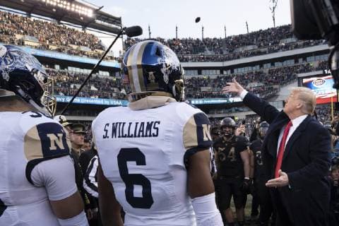 December 9, 2018 - Philadelphia, PA, United States of America - U.S President Donald Trump, right, performs the traditional coin toss before the 119th Army Navy game at Lincoln Financial Field December 8, 2018 in Philadelphia, Pennsylvania. Philadelphia United States of America - ZUMAp138 20181209_zaa_p138_001 Copyright: xJamesxMccannx