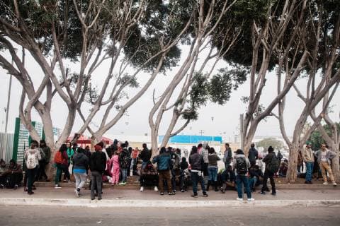 Asylum seekers wait for their number to be called at El Chaparral in Tijuana, Mexico on December 10, 2018. The amount of numbers that are called change daily. This morning 25 numbers were called and later in the day another 25 will be announced.  TJ2018121003 ARIANAxDREHSLER