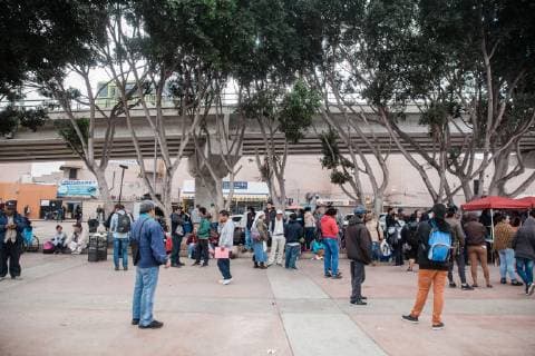 Asylum seekers wait for their number to be called at El Chaparral in Tijuana, Mexico on December 10, 2018. The amount of numbers that are called change daily. This morning 25 numbers were called and later in the day another 25 will be announced.  TJ2018121004 ARIANAxDREHSLER