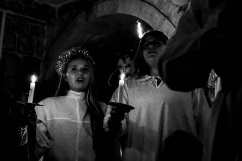 December 13, 2018 - Jerusalem, Israel - The Swedish Theological Institute (STI) in Jerusalem hosts Santa Lucia Day celebrations commemorating Lucia of Syracuse (283-304), Saint Lucy, Saint Lucia, or Sancta Lucia. The feast has become a festival of light, particularly celebrated in Scandinavian countries, where young girls traditionally dressed in white with a red sash, carry palms and wear wreaths of candles on their heads. STI, founded in 1951, is situated in central Jerusalem in Bet Tavor, constructed by Conrad Schick in 1882 and houses the Chapel of St. Bridget. Jerusalem Israel - ZUMAa126 20181213_zap_a126_018 Copyright: xNirxAlonx