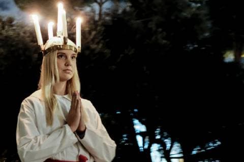 December 13, 2018 - Jerusalem, Israel - The Swedish Theological Institute (STI) in Jerusalem hosts Santa Lucia Day celebrations commemorating Lucia of Syracuse (283-304), Saint Lucy, Saint Lucia, or Sancta Lucia. The feast has become a festival of light, particularly celebrated in Scandinavian countries, where young girls traditionally dressed in white with a red sash, carry palms and wear wreaths of candles on their heads. STI, founded in 1951, is situated in central Jerusalem in Bet Tavor, constructed by Conrad Schick in 1882 and houses the Chapel of St. Bridget. Jerusalem Israel - ZUMAa126 20181213_zap_a126_008 Copyright: xNirxAlonx