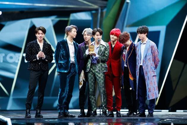 Members of South Korean boy band BTS, also known as the Bangtan Boys, pose with their trophy during the 2018 Mnet Asian Music Awards or MAMA in Hong Kong, China, 14 December 2018. BTS boys hot up 2018 Mnet Asian Music Awards in Hong Kong  20181215_66775
