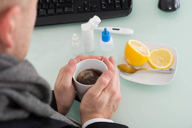  Businessman Holding Cup Of Tea At Office model released Symbolfoto  Copyright: xAndreyPopovx Panthermedia16036371