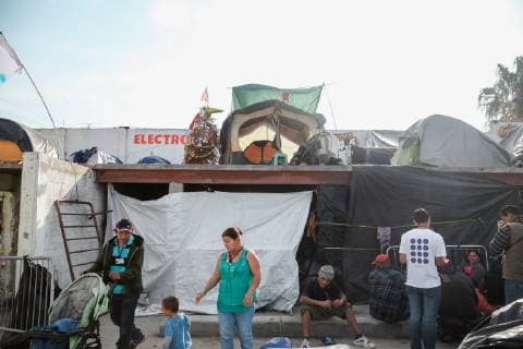 Life continues in the El Baterral shelter in Tijuana, Mexico on December 23, 2018. The U.S. government is in a partial shutdown after President Trump refused to sign a bipartisan agreement, holding out for $5 billion to build an expanded border wall.  TIJ2018122319 ARIANAxDREHSLER