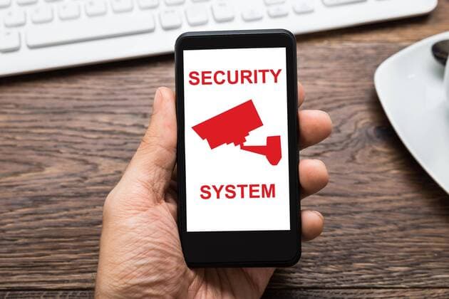  Person Hands Holding Mobile Phone At Desk  Copyright: xAndreyPopovx Panthermedia17721440