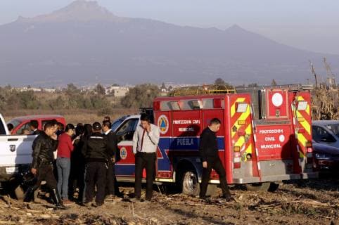 (181225) -- PUEBLA, Dec. 25, 2018 -- Security members work at the helicopter crash site in Coronango, Puebla, Mexico, Dec. 24, 2018. The governor of Mexico s central state of Puebla, Martha Erika Alonso, and her husband Rafael Moreno Valle, ex-governor of the state, were killed in a helicopter crash on Monday, the head of the National Action Party Marko Cortes confirmed. ) (rtg) MEXICO-PUEBLA-ACCIDENT-HELICOPTER CRASH STR