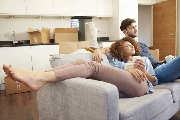  Couple Relaxing On Sofa With Hot Drink In New Home model released Symbolfoto property released  Copyright: xMonkeybusinessx Panthermedia19368074