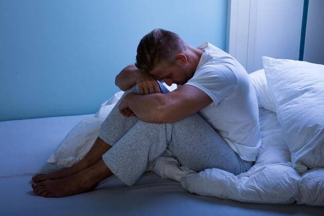  Sad Man Sitting On Bed model released Symbolfoto  Copyright: xAndreyPopovx Panthermedia20118781