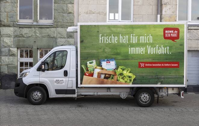 REWE delivery service Delivery trucks of the food chain REWE brings food ordered online to the customers home