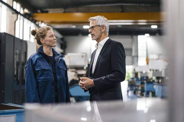Manager and skilled worker of a high tech enterprise having a meeting model released Symbolfoto property released  KNSF04816