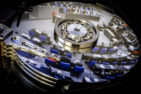 A photo of the plenum of the German Bundestag is reflected on the hard disk of a computer Berlin 07 01 2019 Berlin Germany Copyright: xThomasxTrutschel photothek.netx
