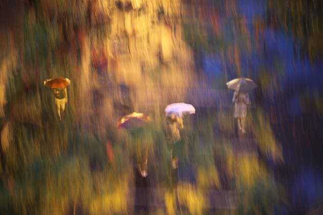 Blurred image of people walking in rain in Central Park, New York City, New York, USA, New York New York USA Copyright: Per-AndrexHoffmann HOPE000221