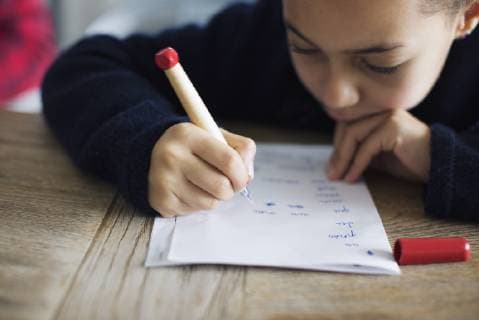 Girl doing homework, close-up  Copyright: Anne-SophiexBost B39408038
