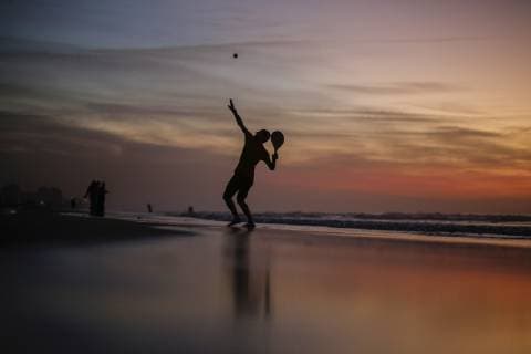 January 12, 2019 - Gaza, Palestine - A Palestinian seen playing tennis at sunset on the beach at the sea of Gaza City. Gaza Palestine - ZUMAs197 20190112_zab_s197_059 Copyright: xMohamedxZarandahx