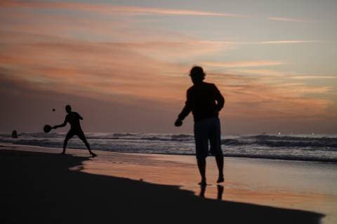 January 12, 2019 - Gaza, Palestine - Palestinians seen playing tennis at sunset on the beach at the sea of Gaza City. Gaza Palestine - ZUMAs197 20190112_zab_s197_055 Copyright: xMohamedxZarandahx