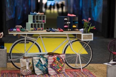 PANORAMA fashion fair Colourful shoe and bag fashion is presented around a white mens bicycle Successful start of the PANORAMA fashion fair on the exhibition grounds at the Funkturm in Berlin Fashion Fashion fair PANORAM Berlin Textile industry Textile industry Garment industry Colourful variety in fashion Creative fashion presentation Fair halls Messe Berlin Berlin Berlin Deu