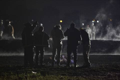 January 19, 2019 - Tlahuelipan, Hidalgo, MEXICO - A massive explosion in Tlahuelilpan, Hidalgo state, Mexico, Friday, January 18, 2019 engulfed people stealing fuel spilling from a pipeline ruptured by thieves in central Mexico killed several people and an unknown number were injured. Pemex surround a burnt body around the area of the explosion. Tlahuelipan MEXICO - ZUMAp124 20190119_zaa_p124_011 Copyright: xAntonioxNavax