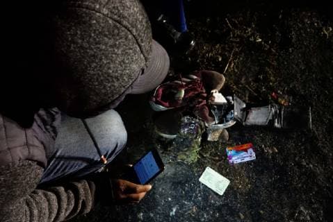 (190119) -- TLAHUELILPAN (MEXICO), Jan. 19, 2019 -- A person checks a victim s personal objects at the site of a pipeline explosion in the municipality of Tlahuelilpan, Hidalgo state, Mexico, on Jan. 19, 2019. The death toll from the pipeline explosion here has risen to 66, governor of the state of Hidalgo said on Saturday. ) MEXICO-HIDALGO-PIPELINE-EXPLOSION CarolinaxEndara 