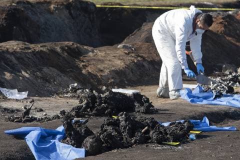 January 19, 2019 - Tlahuelipan, Hidalgo, MEXICO - Saturday, January 19, 2019. Experts from the General Prosecutor Office of Mexico are working on the recovery and identification of bodies in the area where yesterday a Pemex pipeline exploded by a clandestine taking of the gasoline by of huachicoleros that went out of control and left 67 dead, so far, in the San Primitivo community, municipality of Tlahuelilpan, Hidalgo. ANTONIO NAVA PI Tlahuelipan MEXICO - ZUMAp124 20190119_zaa_p124_031 Copyright: xAntonioxNavax