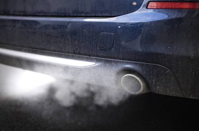 Exhaust fumes come from a car approaching Berlin 28 01 2019 Berlin Germany Copyright: xFelixxZahnx