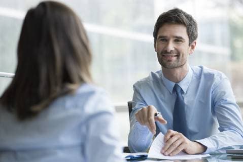 Insurance agent meeting with prospective customer  Copyright: EricxAudras B55876423