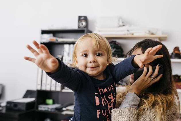 Portrait of a girl with mother at desk talking on cell phone model released Symbolfoto property released  JRFF02111
