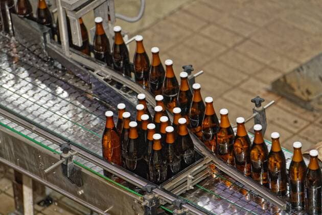 New reusable systems for the beverage market Federal Environment Minister Svenja Schulze visited the Essen private brewery Jacob Stauder GmbH Co KG to find out about modern reusable systems for beverages The Ministers visit was part of the anti-disposal campaign initiated by the Federal Environment Ministry (BMU) In the picture, beer bottles after bottling Essen North Rhine-Westphalia Germany