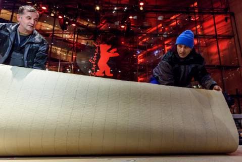 Laying of the red carpet which was produced this year in an environmentally friendly way in front of the Berlinale Palast at Potsdamer Platz on the occasion of the 69th International Film Festival Berlin snapshot photography F Boillot