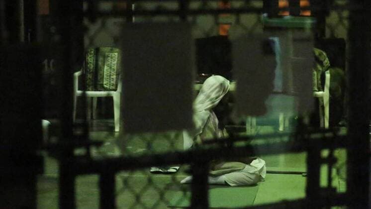 February 6, 2019 - Guantanamo Bay, CUB - A detainee kneels in prayer at sunset on February 11, 2017, at Camp Six at Guantanamo s Detention Center Zone. The military approved release of this photo. Guantanamo Bay CUB - ZUMAm67_ 20190206_zaf_m67_004 Copyright: xEmilyxMichotx