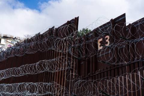 February 6, 2019 - Nogales, United States - Concertina wire, recently added by U.S. Army troops, is seen covering the U.S.-Mexico border wall in Nogales, Arizona on February 6, 2019. Troops began adding additional rows of wire to downtown Nogales this past Saturday and have continued to add more rows this week in and around Nogales while local officials are asking for the wire to be removed. Nogales United States  - ZUMAn230 20190206_zaa_n230_819 Copyright: xMaxxHermanx