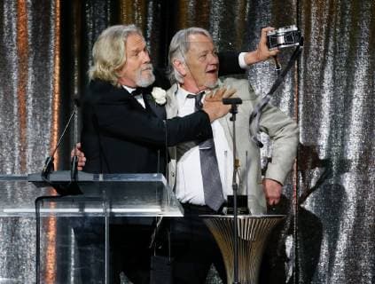 ASC Board of Governors Award honoree Jeff Bridges, left, uses a Widelux panoramic camera to take a photo himself and his stand in and stunt double presenter Loyd Catlett after accepting his award at the 33rd annual ASC Awards and The American Society of Cinematographers 100th Anniversary Celebration at the Ray Dolby Ballroom at Hollywood & Highland, Saturday, February 9, 2019 in Hollywood, California. Photo by Danny Moloshok Moloshok Photography, Inc. imageSPACE MediaPunch Copyright: ximageSPACEx