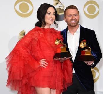 Kacey Musgraves and Shane McAnally appear backstage with their award for Best Country Song for Space Cowboy, during the 61st annual Grammy Awards held at Staples Center in Los Angeles on February 10, 2019.  LAP201902101055 GREGGxDEGUIRE