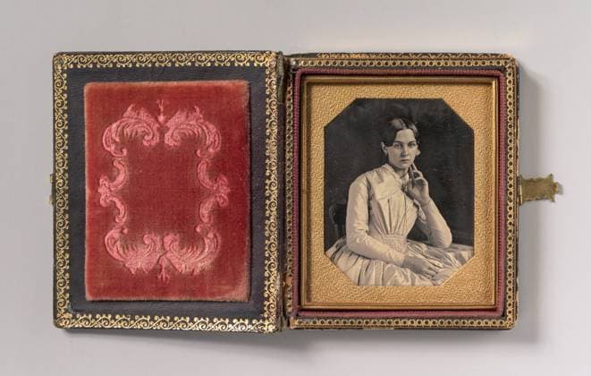 Seated Young Woman with Hand Raised to Jawline , 1840s 1850s, Daguerreotype, Image: 6.5 x 5.2 cm (2 9 16 x 2 1 16 in.), Photographs, Unknown (American), The daguerreotype, the first photographic process, was invented by Louis-Jacques-Mande Daguerre (French, 1787 1851) and spread rapidly around the world after its presentation to the public in Paris in 1839  Copyright: Artokoloro AM170720_062853
