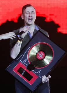 ST PETERSBURG, RUSSIA - FEBRUARY 16, 2019: Lead singer Rustem Bulatov of the Lumen band receives an award at the 2019 Chartova Dyuzhina music award ceremony at VTB Ice Palace. Alexander Demianchuk TASS  TS0A1557