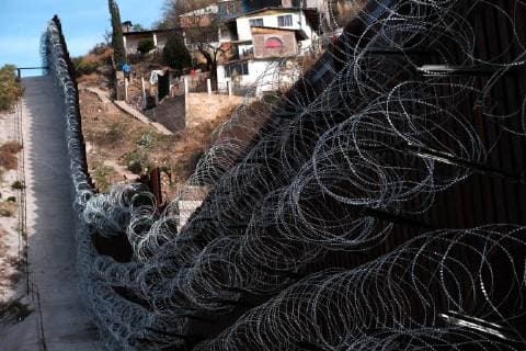February 16, 2019 - Nogales, Arizona, U.S - U.S. army engineers added several more rows of barbed wire to the border wall that seperates Nogales, Arizona from Nogales, Sonora Mexico. President Trump sent several thousand U.S troops to the border who added two rows of concertina wire to the top of the border fence on election day. Last week the soldiers added four additional rows to the outrage of the Nogales Mayor Arturo Garino and the city council . They claim there is no border crisis and the wire at ground level threatens public safety and is bad for business and tourism. They claim it is is a manufactured crisis and that Nogales is a very safe city . The mayor demanded the barbed wire be removed Nogales U.S. - ZUMAb411 20190216_zap_b411_009 Copyright: xChristopherxBrownx