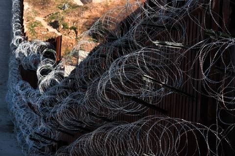 February 16, 2019 - Nogales, Arizona, U.S - U.S. army engineers added several more rows of barbed wire to the border wall that seperates Nogales, Arizona from Nogales, Sonora Mexico. President Trump sent several thousand U.S troops to the border who added two rows of concertina wire to the top of the border fence on election day. Last week the soldiers added four additional rows to the outrage of the Nogales Mayor Arturo Garino and the city council . They claim there is no border crisis and the wire at ground level threatens public safety and is bad for business and tourism. They claim it is is a manufactured crisis and that Nogales is a very safe city . The mayor demanded the barbed wire be removed Nogales U.S. - ZUMAb411 20190216_zap_b411_002 Copyright: xChristopherxBrownx