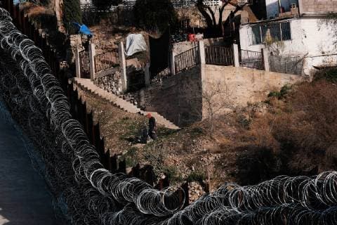 February 16, 2019 - Nogales, Arizona, U.S - U.S. army engineers added several more rows of barbed wire to the border wall that seperates Nogales, Arizona from Nogales, Sonora Mexico. President Trump sent several thousand U.S troops to the border who added two rows of concertina wire to the top of the border fence on election day. Last week the soldiers added four additional rows to the outrage of the Nogales Mayor Arturo Garino and the city council . They claim there is no border crisis and the wire at ground level threatens public safety and is bad for business and tourism. They claim it is is a manufactured crisis and that Nogales is a very safe city . The mayor demanded the barbed wire be removed Nogales U.S. - ZUMAb411 20190216_zap_b411_017 Copyright: xChristopherxBrownx