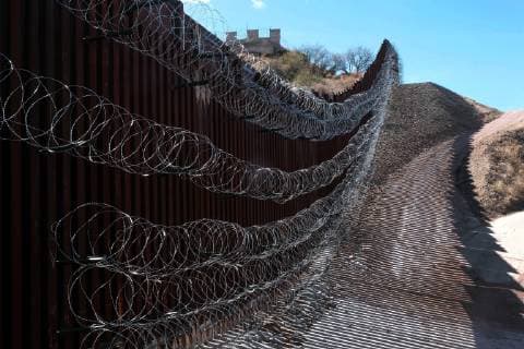 February 16, 2019 - Nogales, Arizona, U.S - U.S. army engineers added several more rows of barbed wire to the border wall that seperates Nogales, Arizona from Nogales, Sonora Mexico. President Trump sent several thousand U.S troops to the border who added two rows of concertina wire to the top of the border fence on election day. Last week the soldiers added four additional rows to the outrage of the Nogales Mayor Arturo Garino and the city council . They claim there is no border crisis and the wire at ground level threatens public safety and is bad for business and tourism. They claim it is is a manufactured crisis and that Nogales is a very safe city . The mayor demanded the barbed wire be removed Nogales U.S. - ZUMAb411 20190216_zap_b411_015 Copyright: xChristopherxBrownx