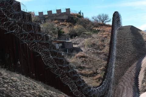 February 16, 2019 - Nogales, Arizona, U.S - U.S. army engineers added several more rows of barbed wire to the border wall that seperates Nogales, Arizona from Nogales, Sonora Mexico. President Trump sent several thousand U.S troops to the border who added two rows of concertina wire to the top of the border fence on election day. Last week the soldiers added four additional rows to the outrage of the Nogales Mayor Arturo Garino and the city council . They claim there is no border crisis and the wire at ground level threatens public safety and is bad for business and tourism. They claim it is is a manufactured crisis and that Nogales is a very safe city . The mayor demanded the barbed wire be removed Nogales U.S. - ZUMAb411 20190216_zap_b411_018 Copyright: xChristopherxBrownx