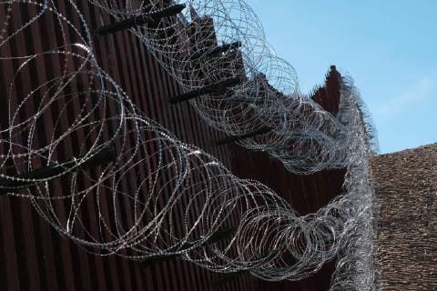 February 16, 2019 - Nogales, Arizona, U.S - U.S. army engineers added several more rows of barbed wire to the border wall that seperates Nogales, Arizona from Nogales, Sonora Mexico. President Trump sent several thousand U.S troops to the border who added two rows of concertina wire to the top of the border fence on election day. Last week the soldiers added four additional rows to the outrage of the Nogales Mayor Arturo Garino and the city council . They claim there is no border crisis and the wire at ground level threatens public safety and is bad for business and tourism. They claim it is is a manufactured crisis and that Nogales is a very safe city . The mayor demanded the barbed wire be removed Nogales U.S. - ZUMAb411 20190216_zap_b411_012 Copyright: xChristopherxBrownx