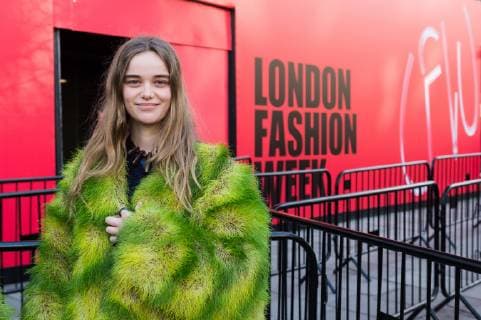February 17, 2019 - London, Greater London, United Kingdom - Activist from Extinction Rebellion wears a coat made of living grass during a demonstration outside London Fashion Week on 17 February, 2019. Protesters call for the British Fashion Council to influence fashion industry to stop the trend of excessive consumption and unsustainable growth in the face of climate change and ecological collapse. Textiles production contributes 1.2 billion tonnes of carbon emissions annually and textiles are the largest single source (34.8%) of microplastic pollution affecting marine life. London United Kingdom  - ZUMAn230 20190217_zaa_n230_194 Copyright: xWiktorxSzymanowiczx