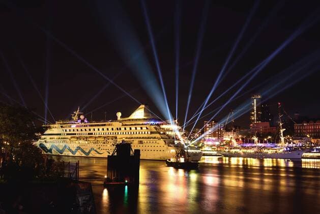 Europe Germany Hamburg Elbe View over the Elbe to the St Pauli landing bridges Skyline St Pauli at night Passenger ship AIDAaura Lasershow McPWAL McPWAL