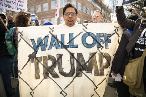 February 18, 2019 - Atlanta, GA, U.S - One hundred demonstrators gathered at the Atlanta field office of U.S. Immigration and Customs Enforcement to protest againt President Trump s declaration of a national emergency in order to fund a wall along the U.S. Mexico border. The protest was part of a nationwide series of protests organized by MoveOn.org, and was locally supported by organizations such as the Georgia Alliance for Social Justice, the ACLU, and Project South. Atlanta U.S. - ZUMAe86_ 20190218_zap_e86_024 Copyright: xStevexEberhardtx